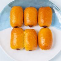 Jumbo Sausage Roll (4 Rolls) · Beef and pork sausage with cheese covered in a sweet bun