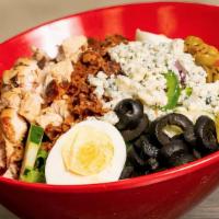 Cobb Salad · Chicken breast, bacon, crumbled bleu cheese, on top of a bed of crisp greens with cucumbers,...