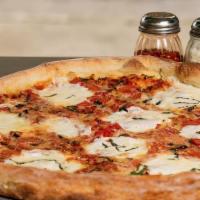 Margherita Pizza · Tomato sauce, fresh mozzarella, fresh tomatoes, fresh basil and garlic.