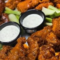 Famous Wings  · Our Famous Wings Tossed In Your Choice of Sauce