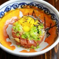 Tuna Tartare · Chopped tuna and cucumber with spicy miso sauce. Served with quail egg and cashew nut.

Cons...