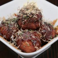 Takoyaki · Fried octopus ball. Served with BBQ sauce and mayonnaise.