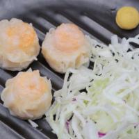 Shrimp Shumai · Steamed shrimp dumpling.