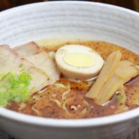 Tonkotsu Ramen “Black” · In tonkotsu soup with egg chashu pork, bamboo shoots, scallion & black sesame oil.