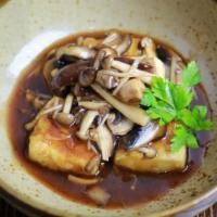 Mushroom Tofu · Sautéed mushroom with teriyaki sauce on fried tofu.