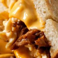 Bbq Mac And Cheese Grilled Cheese · BBQ Pulled Pork and Gooey Mac & Cheese stuffed between two slices of buttered bread and gril...