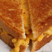 Classic Mac Grilled Cheese · Mac & Cheese and additional cheddar slices stuffed between two slices of buttered bread and ...