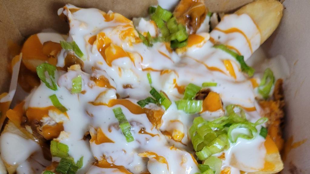 Buffalo Chicken Fries · Fries topped with buffalo chicken, ranch, buffalo sauce and sprinkled with scallions and blue cheese crumbles.