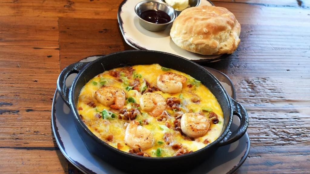 Southern Shrimp & Grits · Shrimp, bacon, green onion, Jack & Cheddar cheeses and cilantro on a bed of stone-ground grits. Served with a biscuit and honey butter.