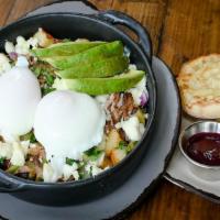 Carnitas Skillet · Harbor potatoes, carnitas, red onion, cilantro, and Queso Fresco cheese, topped with two cag...