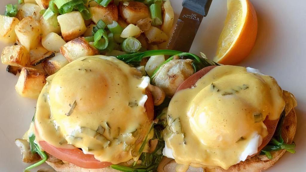 Farmer'S Market Benedict · English muffin, spinach, mushroom, tomato, artichoke, poached cage free eggs and fresh basil hollandaise. Served with Harbor potatoes.