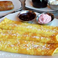 Sam'S Swedish Pancakes · Dusted with powdered sugar. Served with lingonberry butter and lingonberries. Make it a comb...