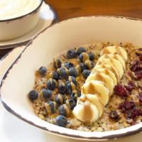 Quinoa Superbowl · Tri-color quinoa, oat milk, blueberries, banana, dried cranberries and a drizzle of sunflowe...
