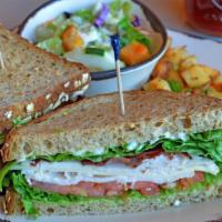 California Club · Turkey, bacon, Jack cheese, avocado, tomato, lettuce and mayonnaise on multigrain. Served wi...