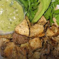 Parrillita Fit · Grilled marinated chicken, steak or both with arugula salad and avocado.