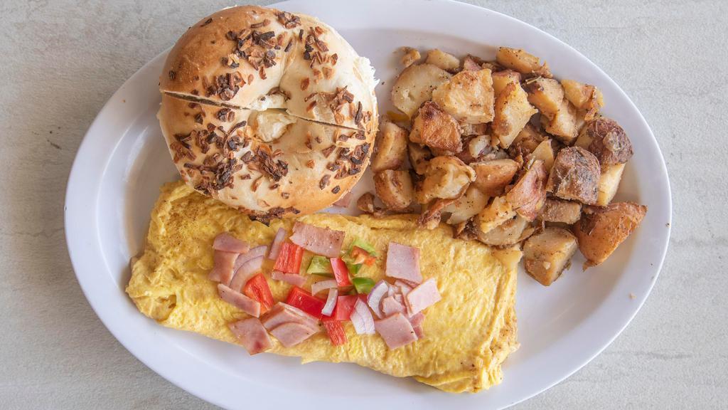 Western Omelette · Eggs with ham, red and green bell peppers, and onions.