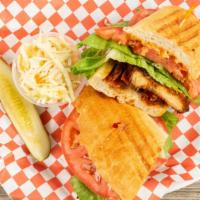 Chicken Club Sandwich  · Panko Chicken, lettuce, tomato, bacon, crispy onions and Chipotle Mayo..... Served with cole...