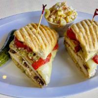 The Capri Panini · Grilled chicken, provolone cheese, roasted peppers, and basil pesto.