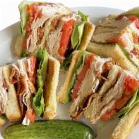 Triple Decker Turkey Club · Roasted turkey, bacon, lettuce, tomato, and mayonnaise.