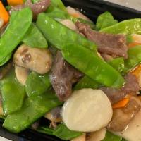 Beef With Snow Peas · Served with white rice.