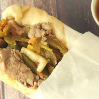 Italian Beef · Thin sliced marinated beef on turano French bread either wet or dry in the au jus with hot g...