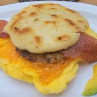 Big Breakfast Arepa · 2 fresh cracked cage-free scrambled eggs, melted Cheddar cheese, bacon, breakfast sausage, g...