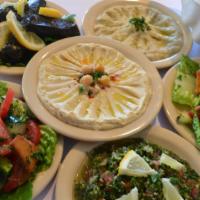 Appetizer Plate · Three side items and a pita.