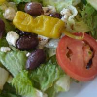 Greek Salad · Fresh mixture of lettuce, tomatoes, cucumbers, Greek peppers, Kalamata olives and crumbly fe...
