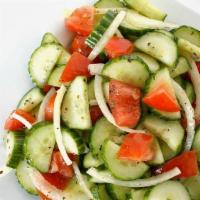 Cucumber Salad · sliced tomatoes, cucumber , and onion with special lemon dressing ,