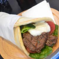 Shish Kabab Wrap · Lean cuts of marinated beef charbroiled to perfection. Served on warm pita bread with lettuc...