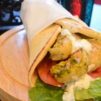 Grilled Shrimp Wrap · Grilled jumbo shrimp marinated with Mediterranean spices, garlic and herbs. Served on warm p...