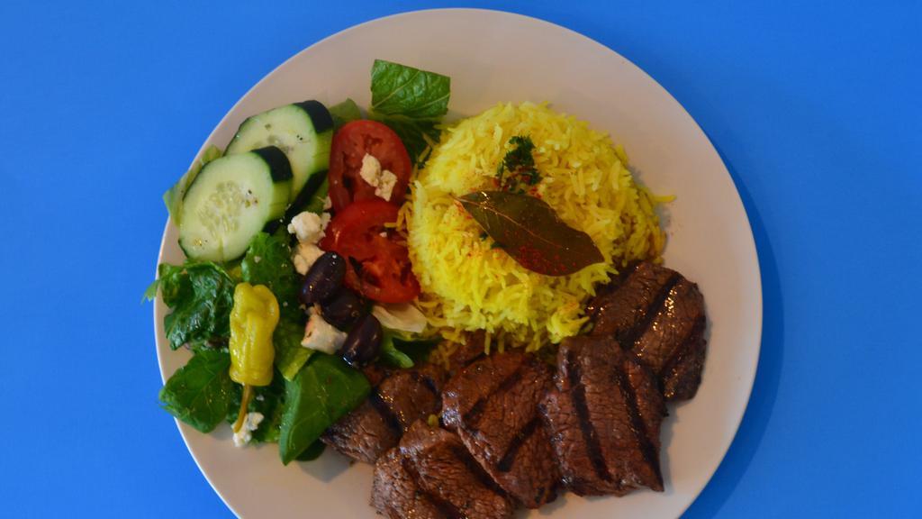Shish Kabab Platter · Lean cuts of marinated charbroiled cubes of tender beef. Served with basmati yellow rice,  salad, warm pita.