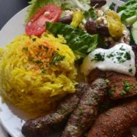 Sinbad Mixed Grill Platter · Gyro slices, shish kabob and Kufta kabob. Served with basmati yellow rice,  salad, warm pita.