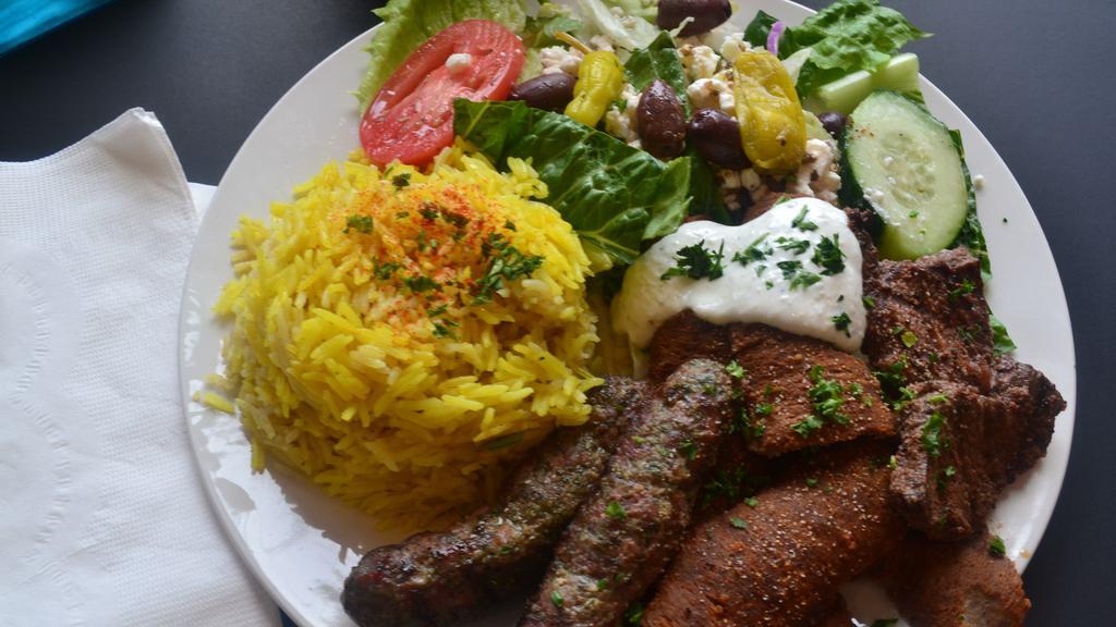 Sinbad Mixed Grill Platter · Gyro slices, shish kabob and Kufta kabob. Served with basmati yellow rice,  salad, warm pita.