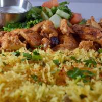 Chicken Shawarma Platter  · Thin slices of seasoned chicken thigh  . Served with Greek salad, basmati rice and warm pita...