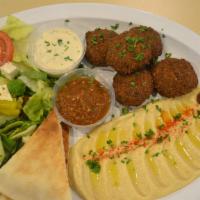 Falafel Platter · Deep fried patties of ground chickpeas, herbs and an ethnic spice blend. Served with Greek s...