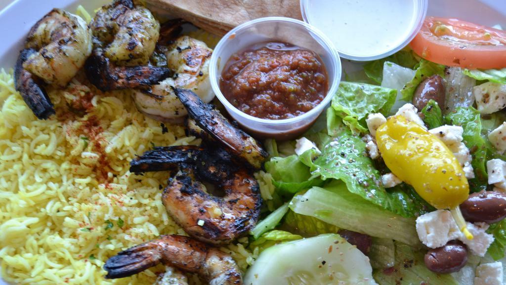 Grilled Shrimp Platter · Grilled jumbo shrimp marinated with Mediterranean spices, garlic and herbs. Served with basmati rice,  salad, warm pita and choice of your sauce.