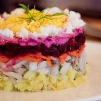 Seld' Pod Shuboy · Traditional and famous Russian salad with herring, potato, beetroot and carrot.