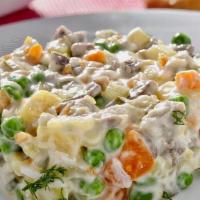 Olivier Salad With Veal · The most popular and famous salad. 

Made with diced boiled potatoes, carrots, brined dill p...
