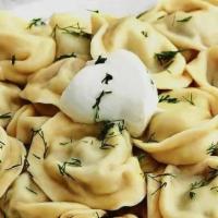 Pelmeni With Lamb · Traditional dumplings stuffed with lamb. Served with sour cream