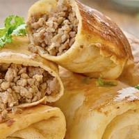 Crepes With Meat · Very thin and very juicy crepes with baked beef and onion. Served with a sour cream