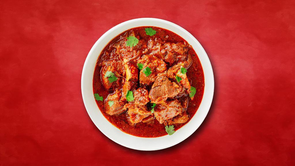 Country Side Lamb Curry · Pieces of lamb sauteed with fresh garlic, ginger, and tomatoes.