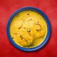 Royale Rasmalai · Cottage cheese patties flattened and soaked in milk with whole spices.