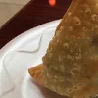 Vegetable Samosa (2) · Triangular pastry stuffed with mixed vegetable.