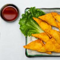 Crab Rangoon (8) · served with red sweet and sour sauce on the side