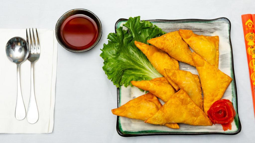 Crab Rangoon (8) · served with red sweet and sour sauce on the side