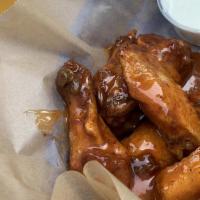 Latin Fusion Wings · Chicken Wings Glazed with Our Signature Fusion Sauce: Peach Bourbon, Mango Habanero, Sweet L...