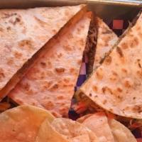 The Perfect Quesadilla · Flour tortilla grilled and filled with cheese. Served with tortilla chips and salsa.