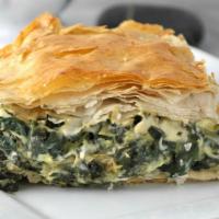 Spanakopita · Baked fillo dough filled with sautéed onions, spinach, Feta cheese and Turkish herbs.