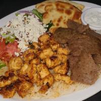 Mixed Gyro Platter · Chicken Gyro and Lamb Gyro. All entrees are served with rice, greek salad, and the fresh-bak...
